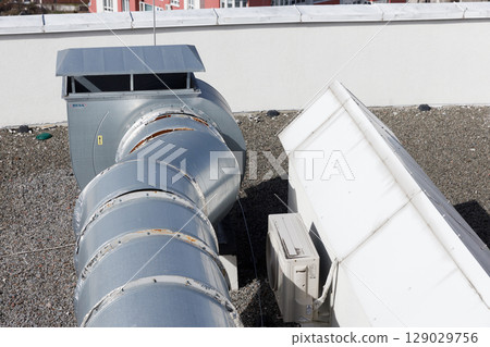 Industrial Ventilation System on Rooftop: Highlighting Vent Pipes and HVAC Equipment for Efficient Air Circulation and Maintenance in Commercial Buildings Industrial Ventilation System on Rooftop: Highlighting Vent Pipes and HVAC Equipment for Efficient Air Circulation and Maintenance in Commercial Buildings 129029756