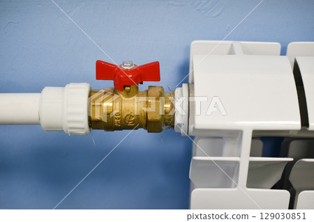 A water radiator for heating. A white radiator for indoor heating. 129030851