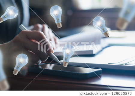 Creative brainstorming session with glowing ideas 129030873