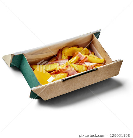 Cardboard takeaway box containing roasted potato wedges, bacon and cheese sauce Cardboard takeaway box containing roasted potato wedges, bacon and cheese sauce 129031198