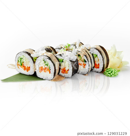 Delicious vegan sushi rolls with vegetables and cream cheese resting on a bamboo leaf 129031229