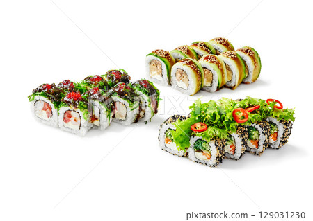 Variety of delicious sushi rolls displayed on white background 129031230