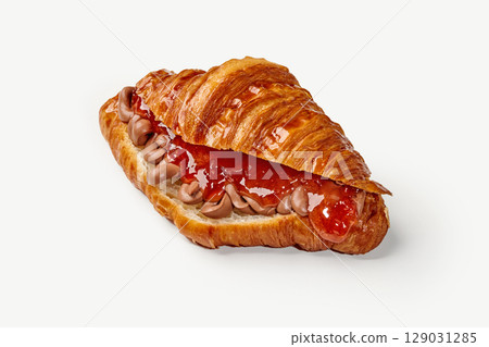 Delicious croissant filled with chocolate cream and strawberry jam on white background 129031285