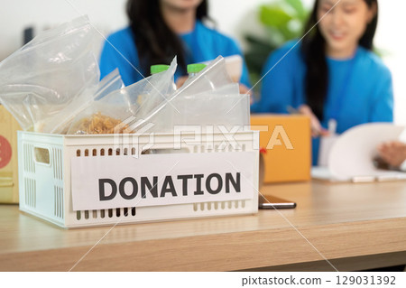 Donation basket filled with items, showcasing community support Donation basket filled with items, showcasing community support 129031392