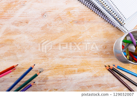 School stationery on wooden table 129032007