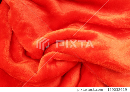 red fluffy background of red color. Uneven Red Fabric Background. 129032619