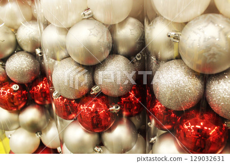 White Red Christmas Balls in Packaging Close-Up. White Red Christmas Balls in Packaging Close-Up. 129032631