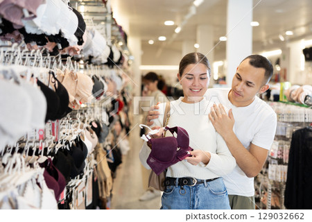 Couple man and woman choosing bra 129032662