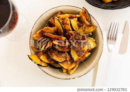 Fried eggplant with honey, classic Andalusian dish Fried eggplant with honey, classic Andalusian dish 129032763