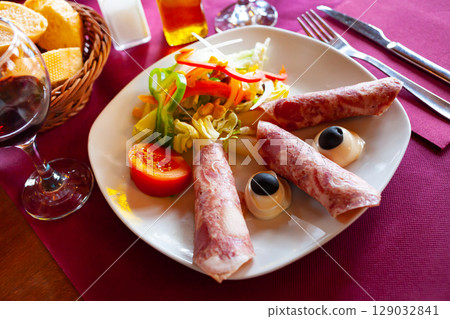 Ham rolls with asparagus mayonnaise and salad Ham rolls with asparagus mayonnaise and salad 129032841