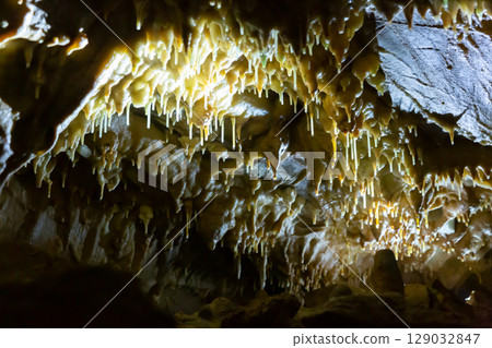 Stalactites, stalagmites and streak formations in cave of Balzarca. Moravian Karst. Czech Republic Stalactites, stalagmites and streak formations in cave of Balzarca. Moravian Karst. Czech Republic 129032847