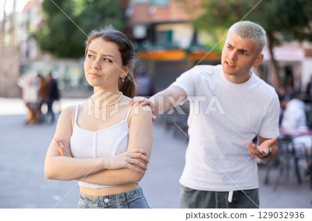 guy and his girlfriend quarreled on the street guy and his girlfriend quarreled on the street 129032936