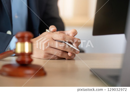 Legal Professional. Lawyer holding pen and preparing for consultation. 129032972
