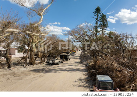 Trash from severely damaged houses after hurricane Milton storm surge. Piles of debris on street side on Manasota key street in Florida. Consequences of natural disaster Trash from severely damaged houses after hurricane Milton storm surge. Piles of debris on street side on Manasota key street in Florida. Consequences of natural disaster 129033224
