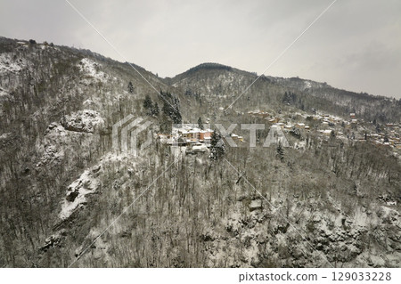 Traditional mountain remote cabins and houses in winter highlands 129033228