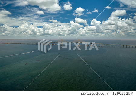 Sunshine Skyway Bridge over Tampa Bay in Florida with moving traffic. Concept of transportation infrastructure 129033297