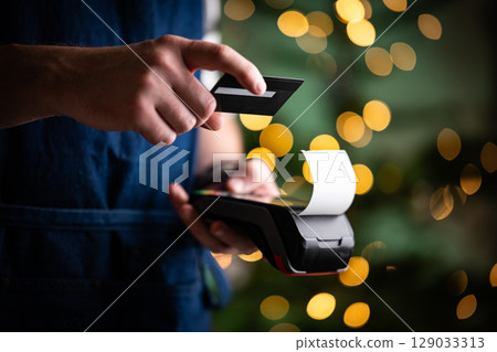 Waiter Holding In Hands Credit Card And Wireless Paying Terminal Waiter Holding In Hands Credit Card And Wireless Paying Terminal 129033313