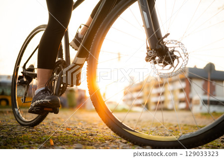 Bicycle Wheel With Female Foot On Pedals Bicycle Wheel With Female Foot On Pedals 129033323