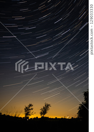 Amazing Night Landscape With Star Trails 129033330