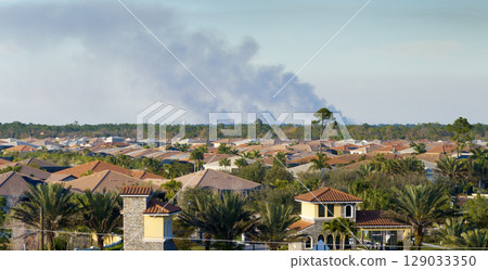 Suburban neighborhood in Florida suffering from bad air quality polluted with prescribed forest fire smoke Suburban neighborhood in Florida suffering from bad air quality polluted with prescribed forest fire smoke 129033350