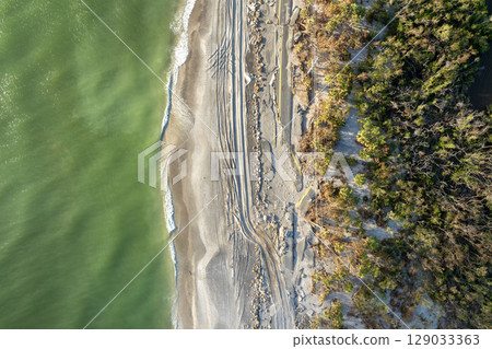 Storm surge destroyed oceanfront road on Gulf coast after hurricane in Florida. Severe damage to transportation infrastructure 129033363