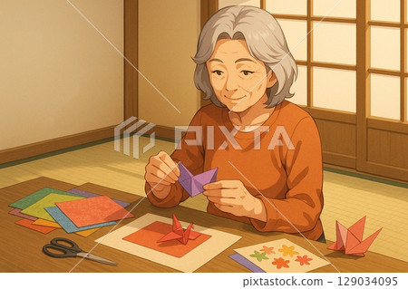 一位老婦人正在使用和紙摺紙 129034095