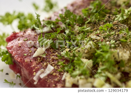 Raw Beef Steak with Herbs and Onions Raw Beef Steak with Herbs and Onions 129034179