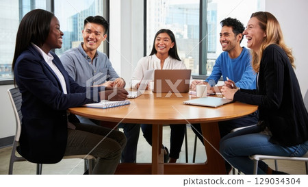 Team of professionals collaborating during a business meeting in a modern office space. Generative AI. 129034304