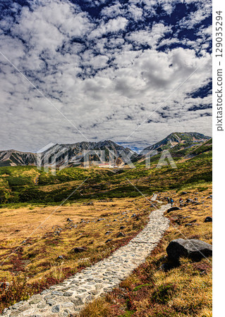 Walking the mountain trails in autumn at Mt. Tateyama 129035294