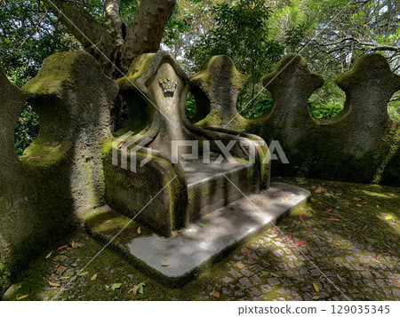 A stone throne in the park of Vila Sassetti in Sintra, Portugal A stone throne in the park of Vila Sassetti in Sintra, Portugal 129035345