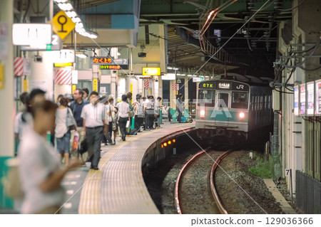 Photograph of the 203 series running on the Joban local line at Shin-Matsudo Station 129036366