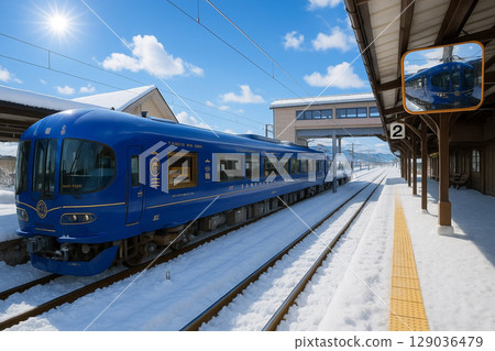 Limited express Hashidate train stopped at Amanohashidate Station in a snowy landscape. TANGO NO UMI 129036479