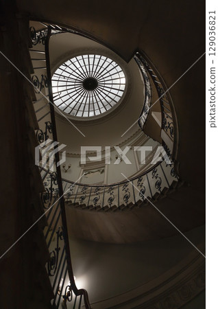 the Nelson Staircase within Somerset House in London, a grand spiral staircase inside a neoclassical building, 129036821