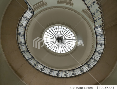 the Nelson Staircase within Somerset House in London, a grand spiral staircase inside a neoclassical building, the Nelson Staircase within Somerset House in London, a grand spiral staircase inside a neoclassical building, 129036823