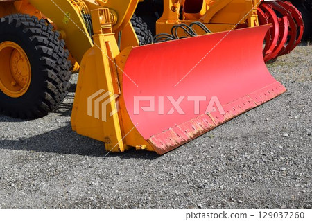 Snowplow waiting in a snowy country Snowplow waiting in a snowy country 129037260