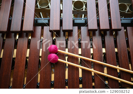 A marimba and the red mallets on top A marimba and the red mallets on top 129038252