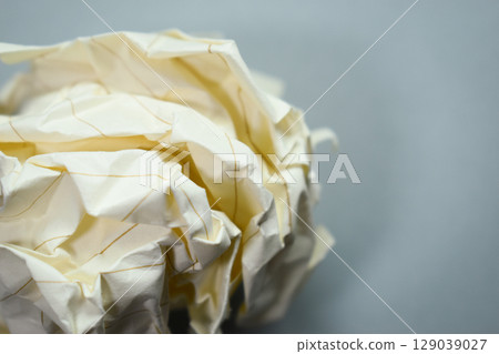 round lump paper on grey background, recycle used paper round lump paper on grey background, recycle used paper 129039027
