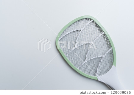 green mosquito swatter isolated on white background 129039086
