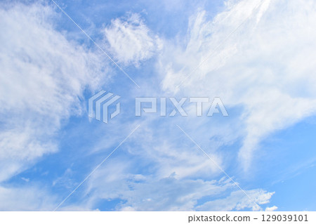 beautiful blue sky and white fluffy group of clouds with sunrise in the morning, natural background beautiful blue sky and white fluffy group of clouds with sunrise in the morning, natural background 129039101