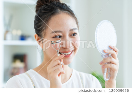 A young woman using a bureaus 129039656