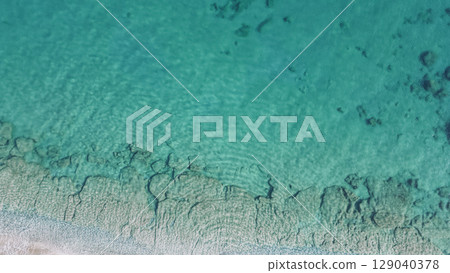 Natural aerial seascape. Drone shot of paradise sea with clear water and underwater terrain 129040378