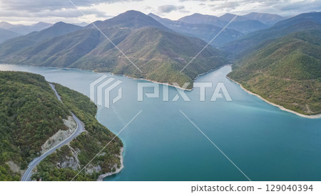 Zhinvali Reservoir in Georgia, scenic lake surrounded by green mountains and forests 129040394