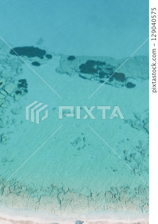 Natural marine background. Aerial drone view of sea bottom. Turquoise clear water Natural marine background. Aerial drone view of sea bottom. Turquoise clear water 129040575
