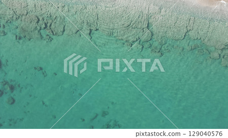 Natural marine background. Aerial drone view of sea bottom. Turquoise clear water 129040576