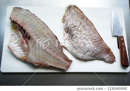 Filleting sea bream (using a small deba knife) Filleting sea bream (using a small deba knife) 129040998