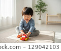 Child playing with toy cars 129042103