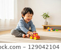Child playing with toy cars 129042104
