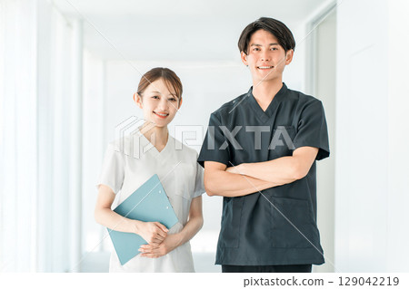 Medical workers in scrubs, medical staff, male doctors and female nurses in white coats 129042219