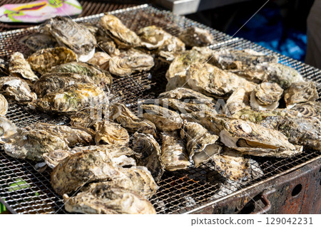 Delicious grilled oysters Delicious grilled oysters 129042231