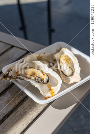 Delicious grilled oysters 129042233